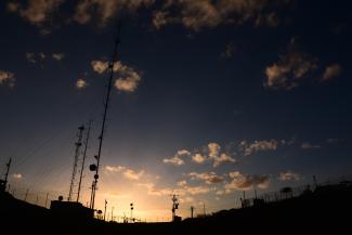Air base silhouette against sky