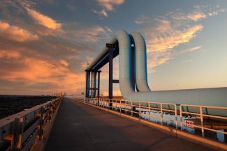Natural gas/oil pipeline against sunset sky